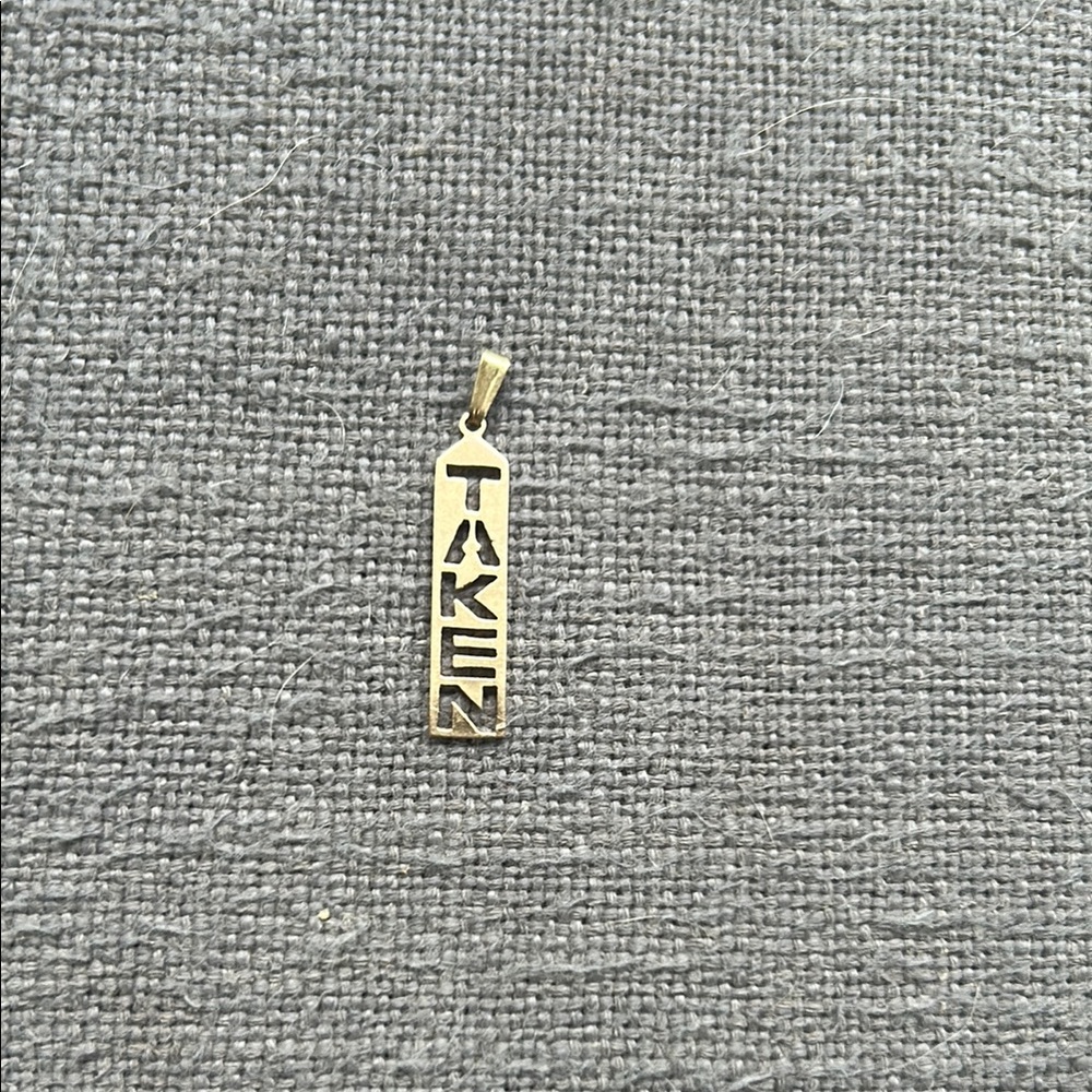 Gold 'TAKEN' Pendant